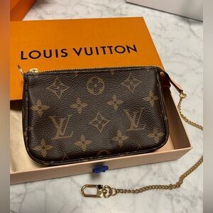 Sold - Authentic mini pochette accessories
